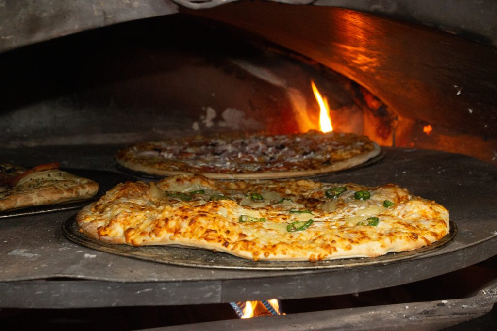 Three pizzas in an oven